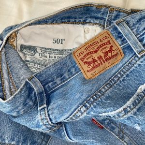 Levi 501 jeans they fit like mom jeans the rips are super cute